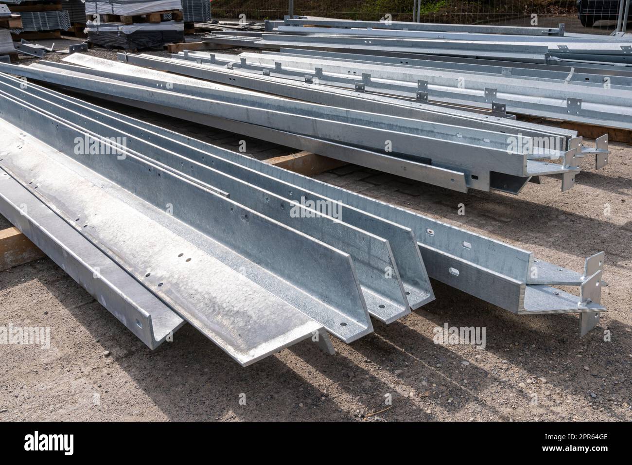 Stack of grey structural metal profiles at a building construction site Stock Photo