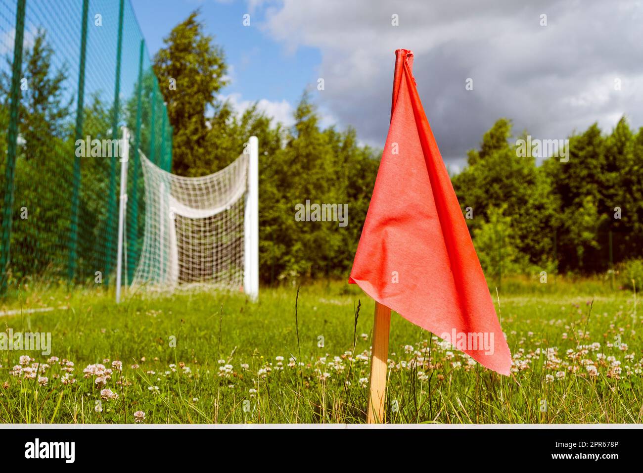 Red corner flag on the soccer stadium Stock Photo