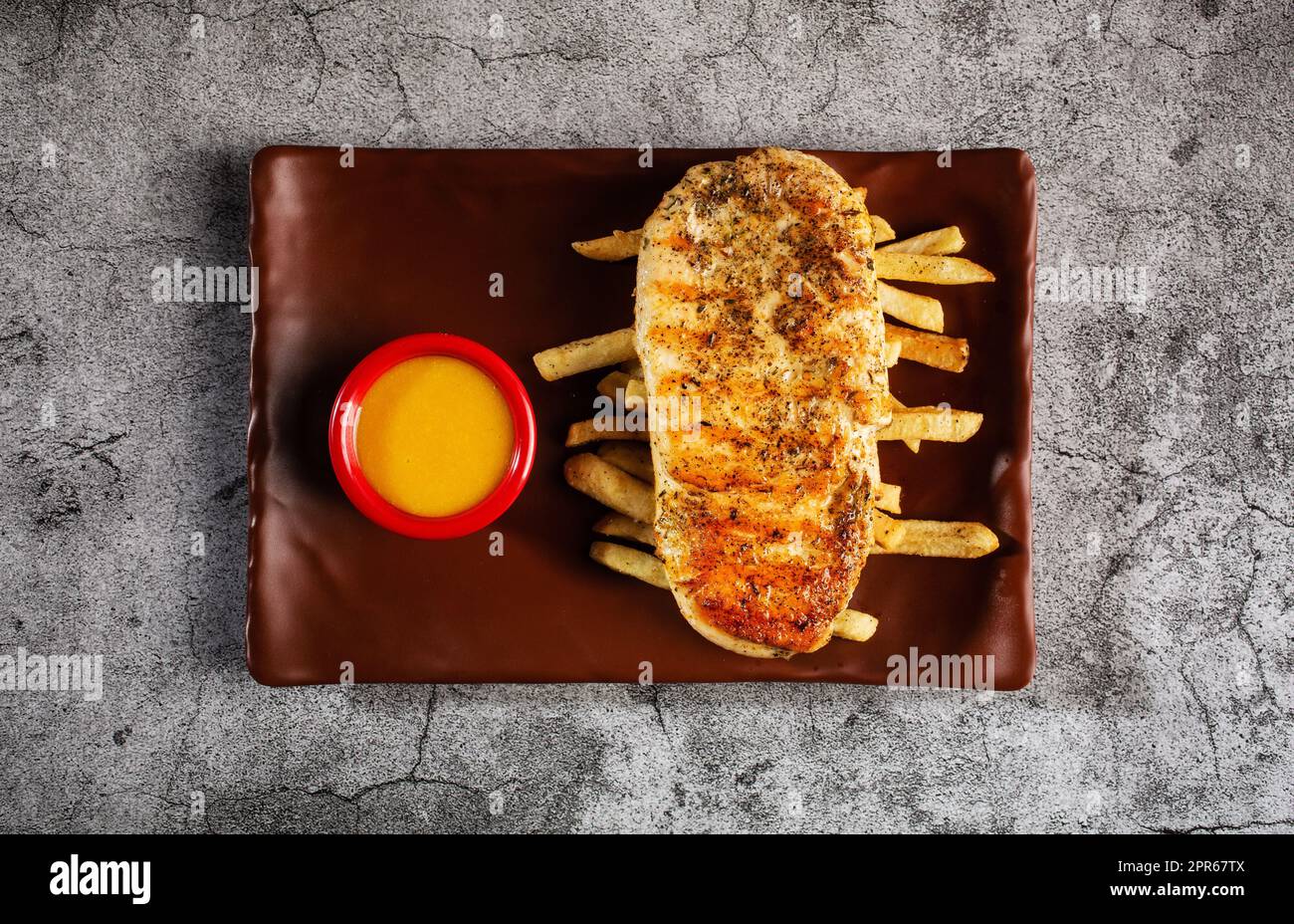 Chicken steak Served with honeymustard sauce Stock Photo Alamy