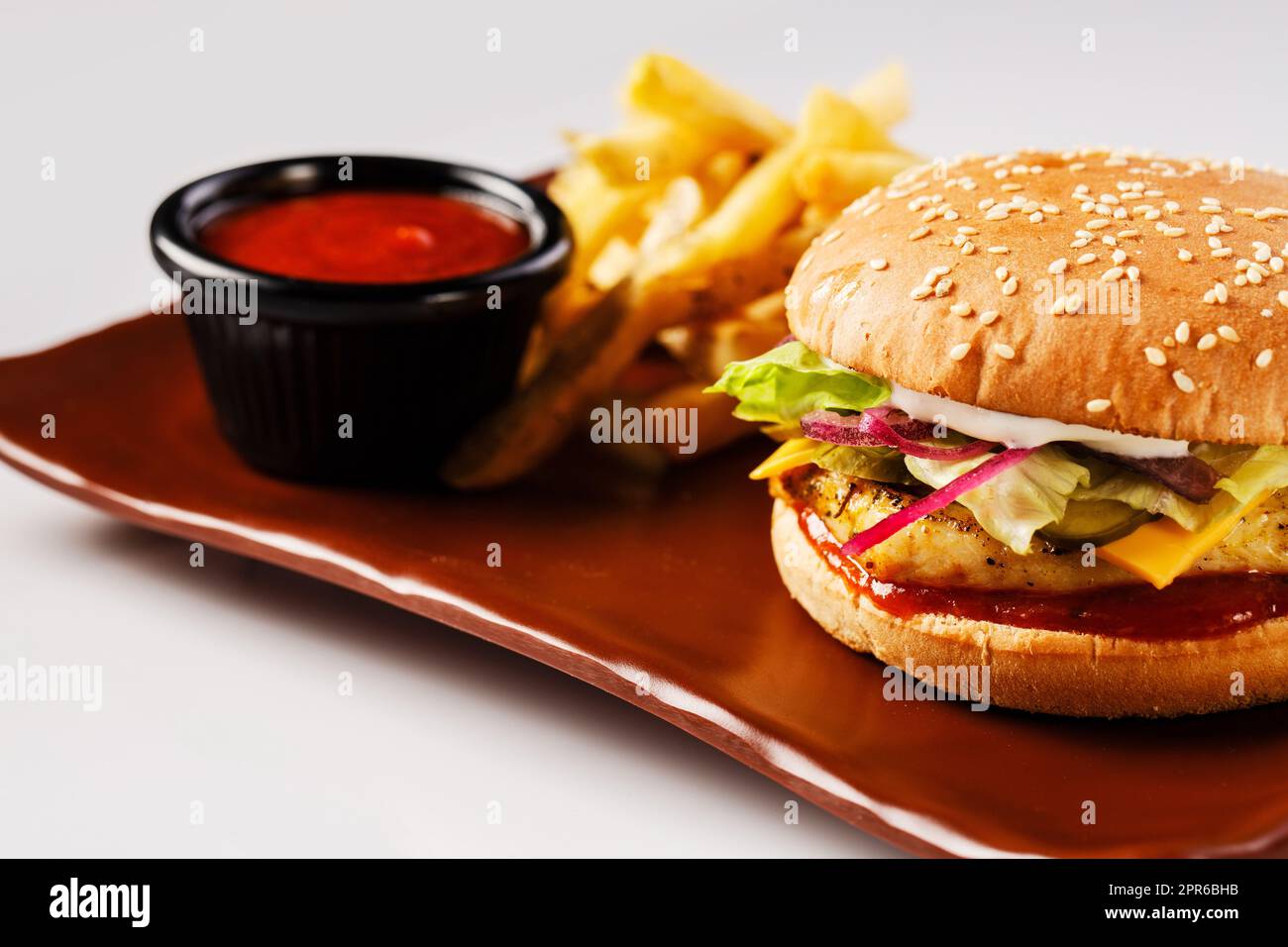 Burger. Juicy pork cutlet, cheddar cheese, crispy pickled onions