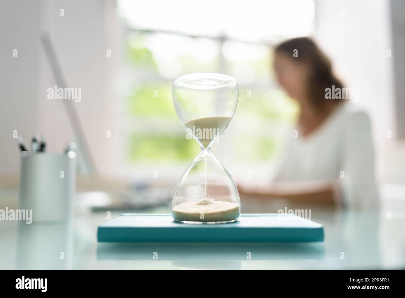 Late Invoice And Billing Deadline With Hourglass Stock Photo