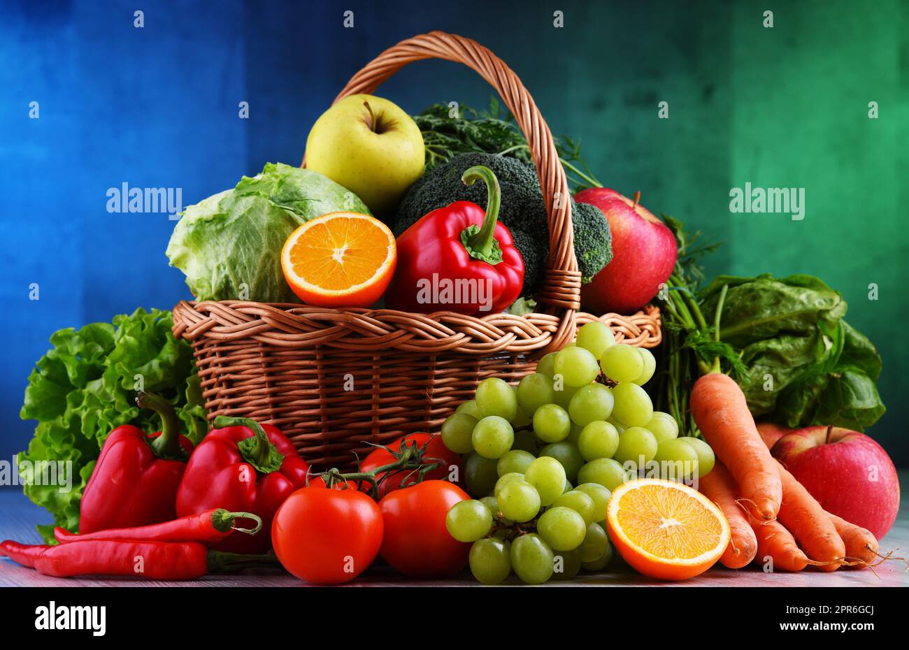 Fresh organic fruits and vegetables in wicker basket Stock Photo - Alamy