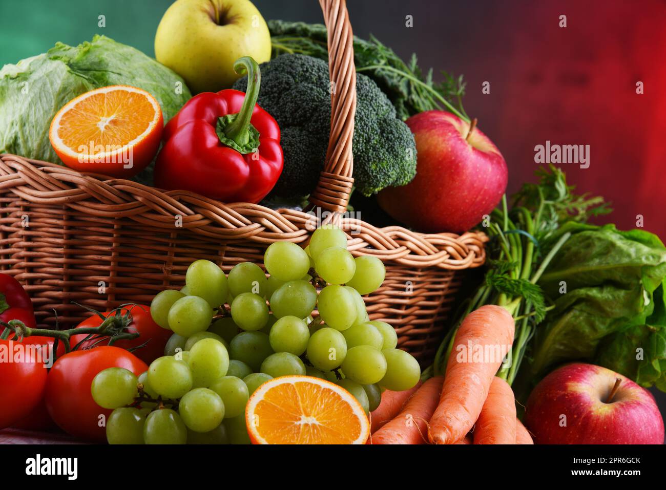 Fresh organic fruits and vegetables in wicker basket Stock Photo - Alamy
