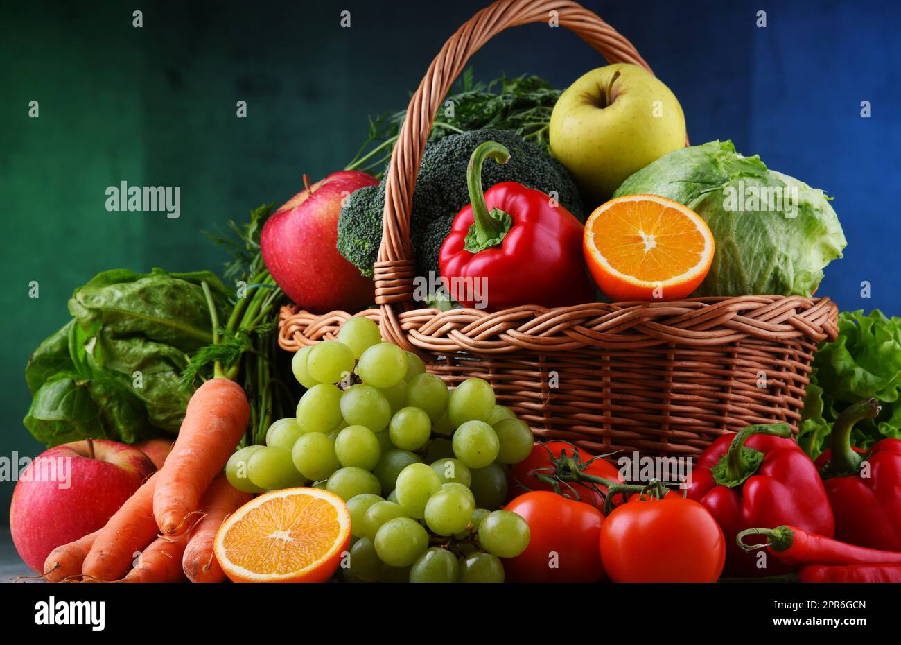 Fresh organic fruits and vegetables in wicker basket Stock Photo - Alamy