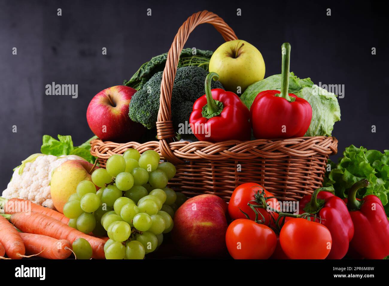 Fresh organic fruits and vegetables in wicker basket Stock Photo - Alamy