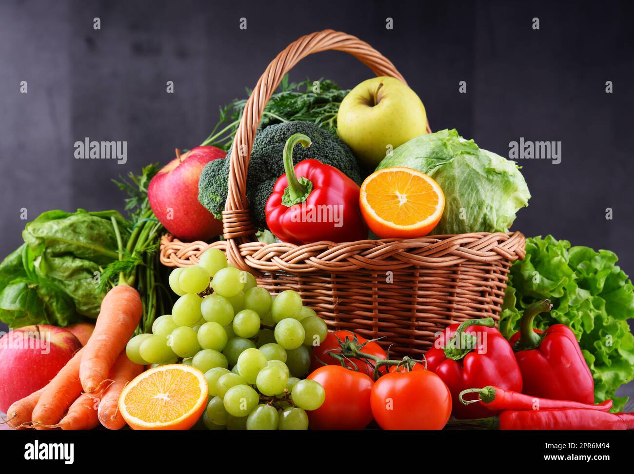 Fresh organic fruits and vegetables in wicker basket Stock Photo - Alamy