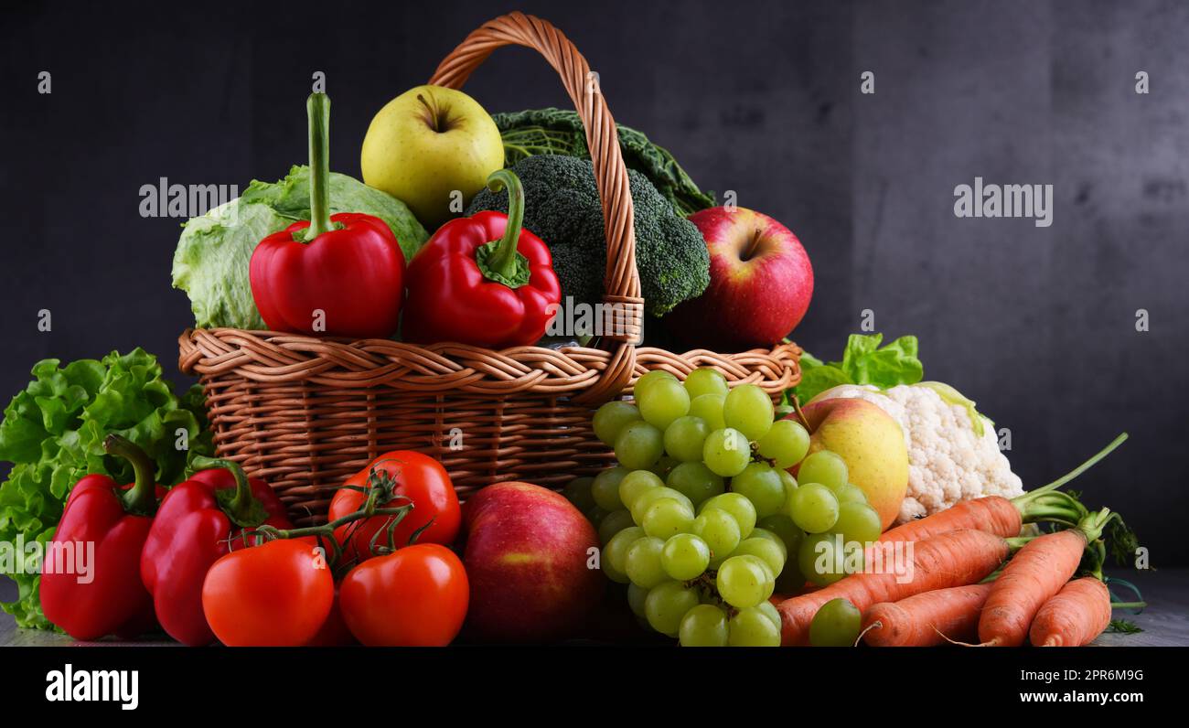 Fresh organic fruits and vegetables in wicker basket Stock Photo - Alamy