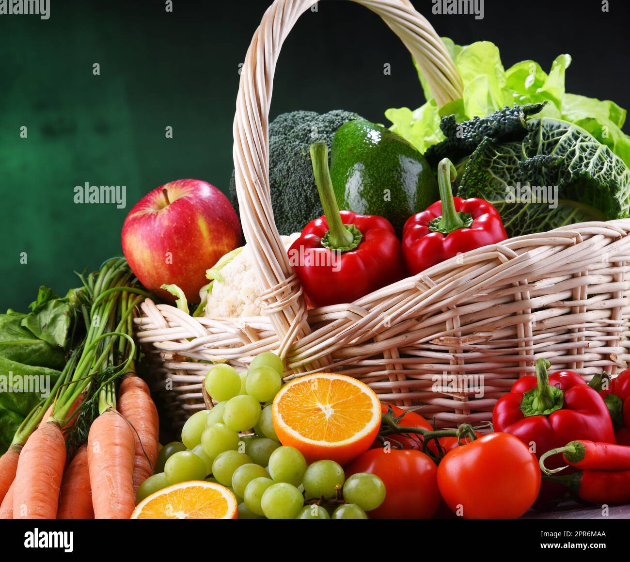 Fresh organic fruits and vegetables in wicker basket Stock Photo - Alamy