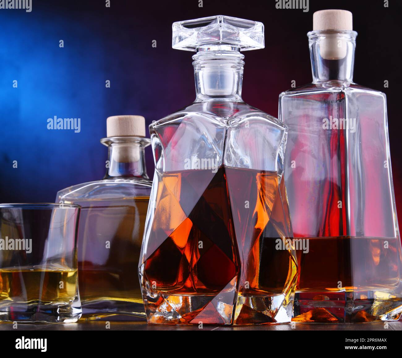 Carafe and bottles of assorted alcoholic beverages Stock Photo