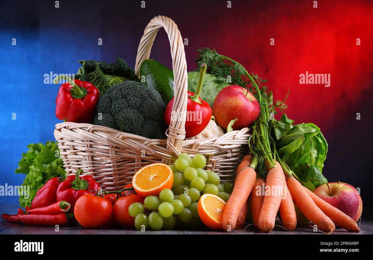 Fresh organic fruits and vegetables in wicker basket Stock Photo - Alamy