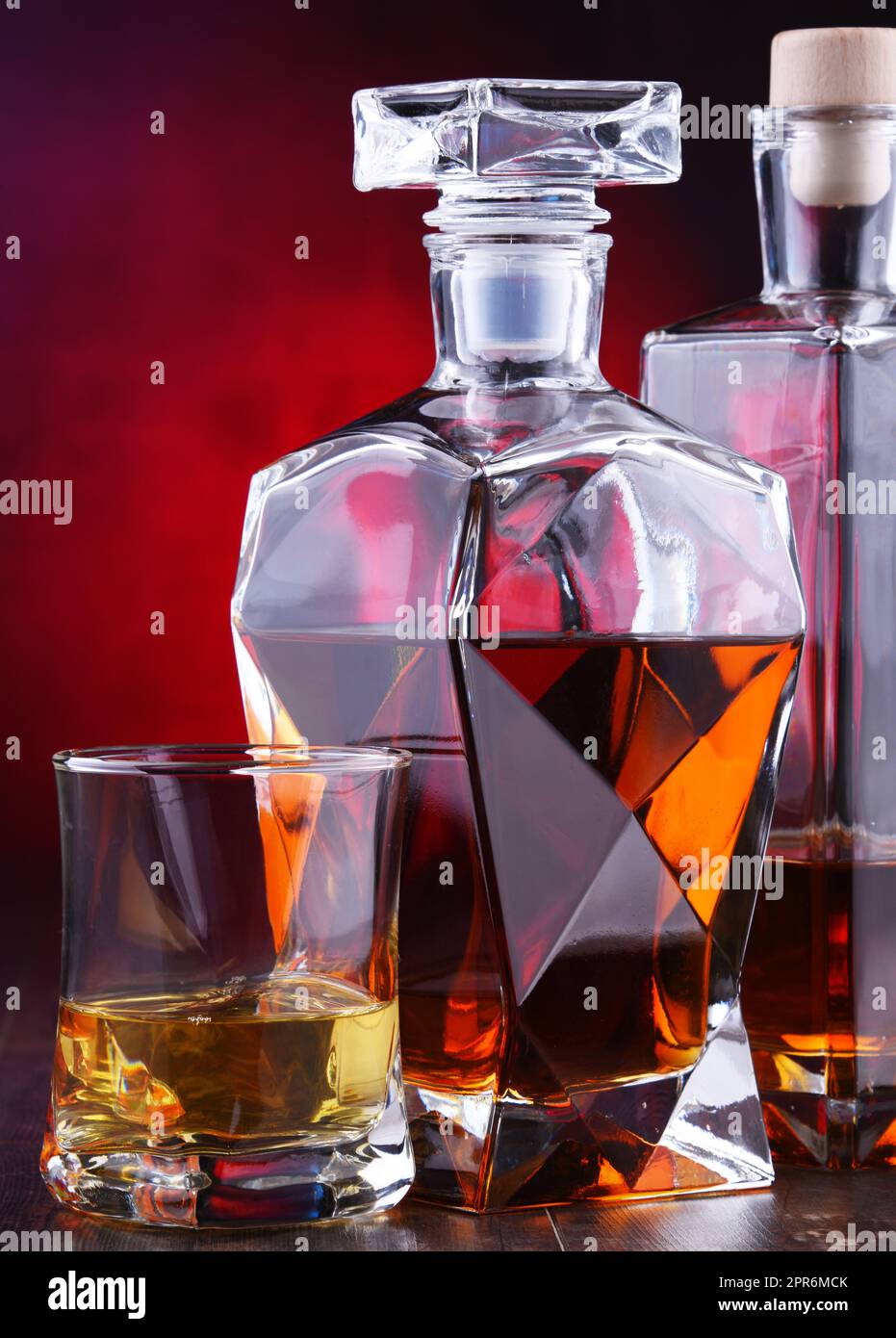 Carafe and bottles of assorted alcoholic beverages Stock Photo