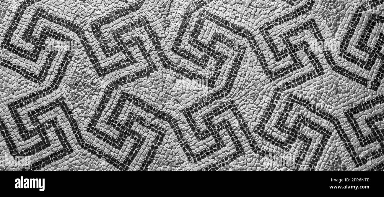 Swastika symbol in ancient Celtic mosaic decoration. Design for an old style background. Stock Photo