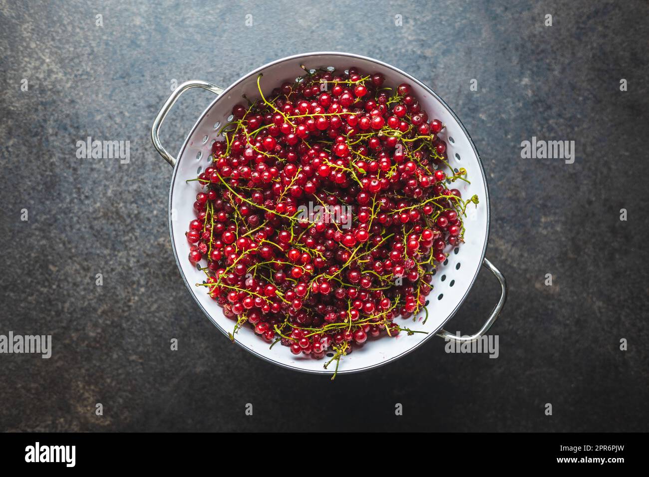 Ripe red currant in colander. Stock Photo