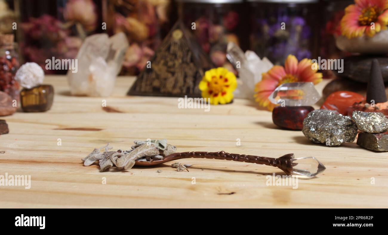 Sage in Vintage Spoon on Meditation Altar With Pyramid in Background Stock Photo
