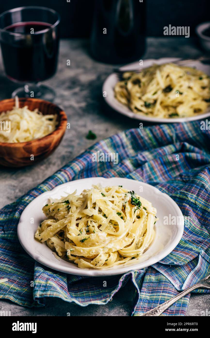 Two Portions of Homemade Pasta Alfredo Stock Photo