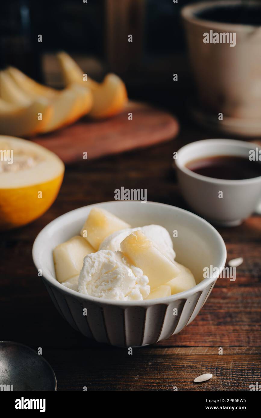 Ice Cream with Slices of Honeydew Melon Stock Photo