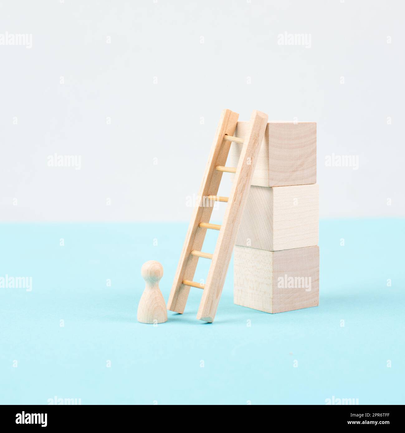 Man is standing next to a ladder, climbing up in career, having a goal ...