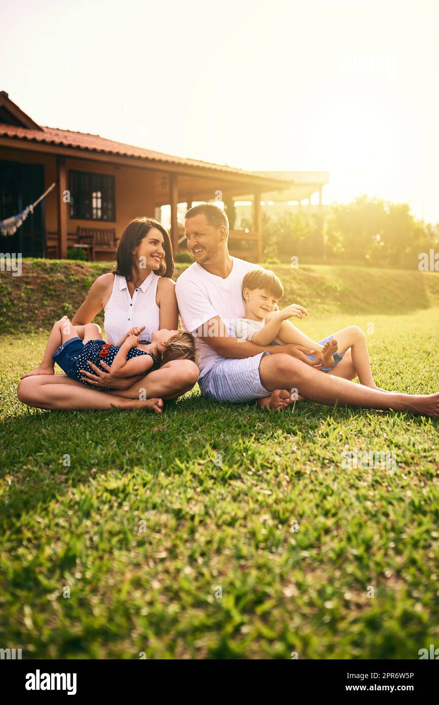 Being with family is bliss. Shot of a happy family bonding together outdoors. Stock Photo