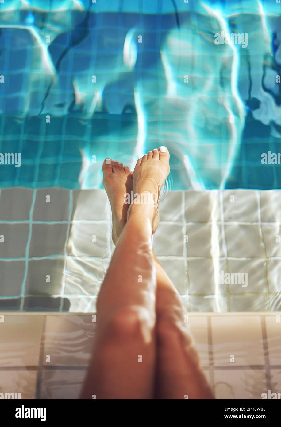Luxurious legs. Cropped shot of a womans feet in the water of a spa pool. Stock Photo