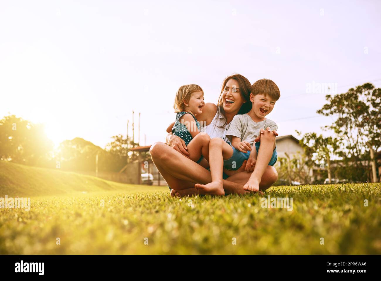 Her boys fill her life with joy. Cropped shot of a young family spending time together outdoors. Stock Photo