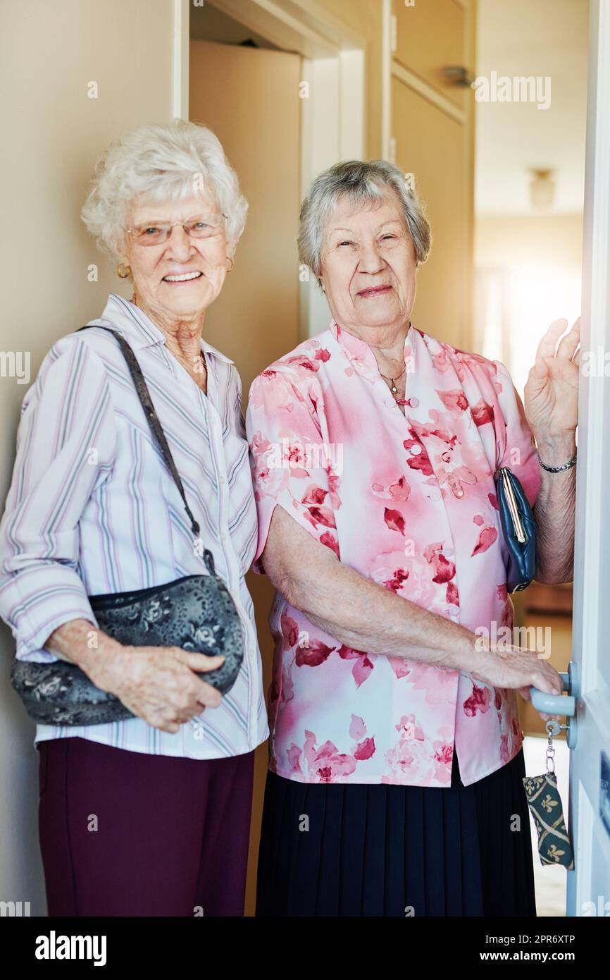 Lets go paint the town red. Portrait of two elderly woman closing the
