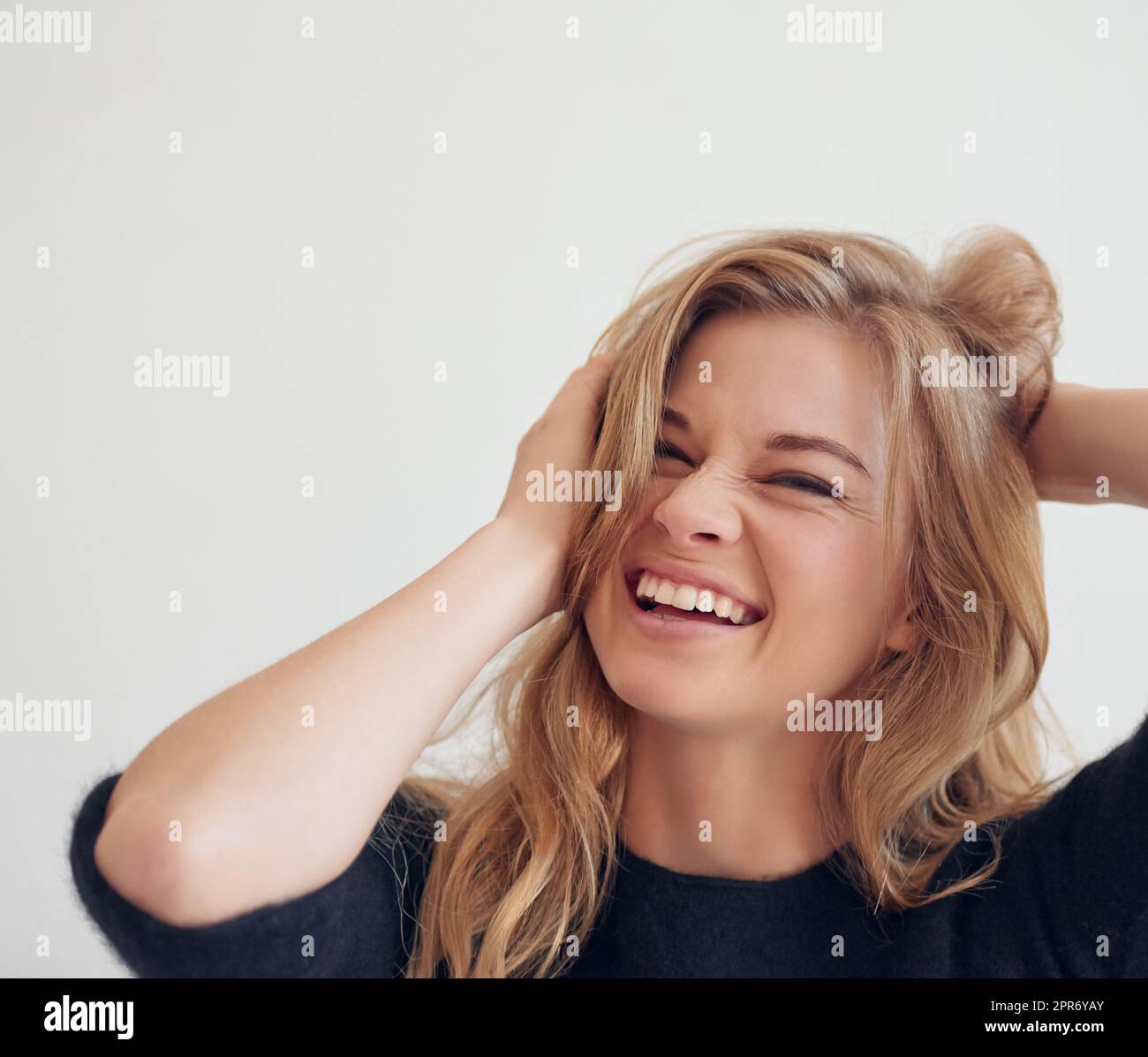 Love is in the hair. Shot of a beautiful woman looking ecstatic. Stock Photo