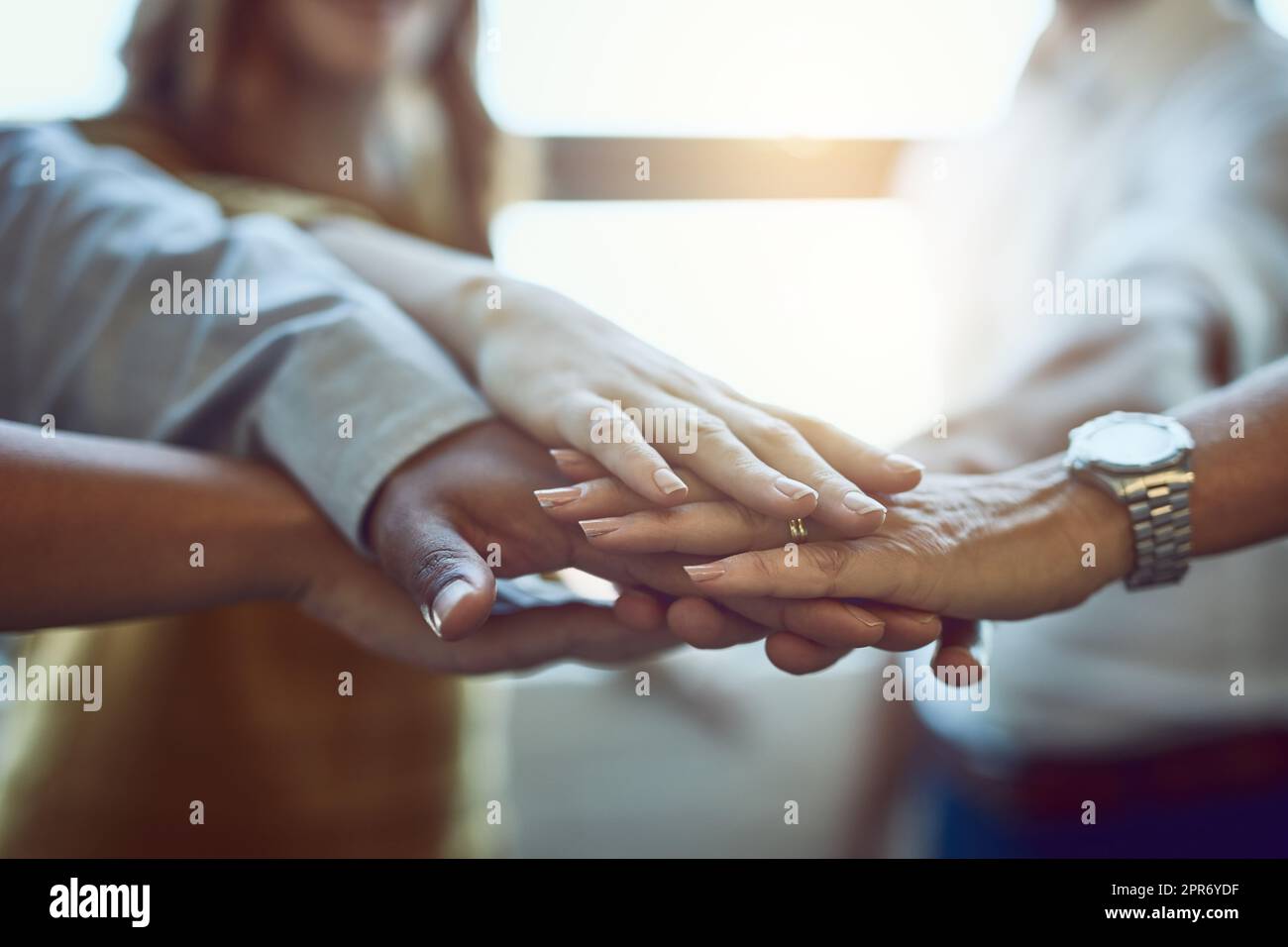 Many hands make light work. Cropped shot of a group of colleagues