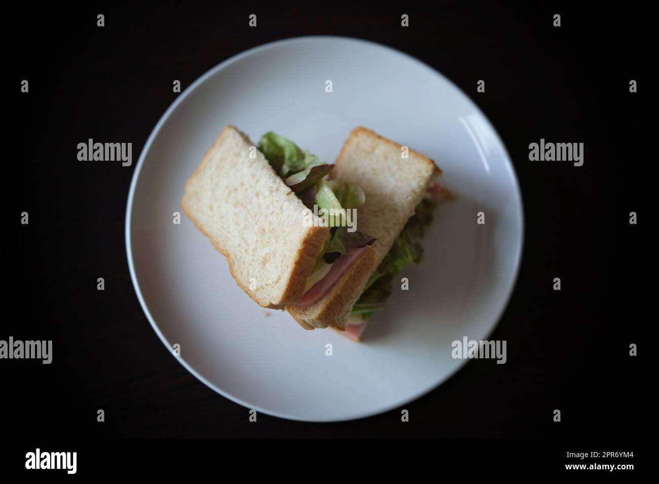 Sandwiches with egg, ham and toast cheese fried in white dish Stock Photo