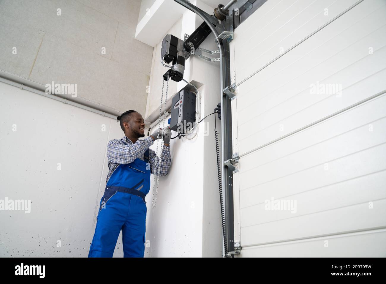 Installing Automatic Garage Door Or Gate Stock Photo Alamy