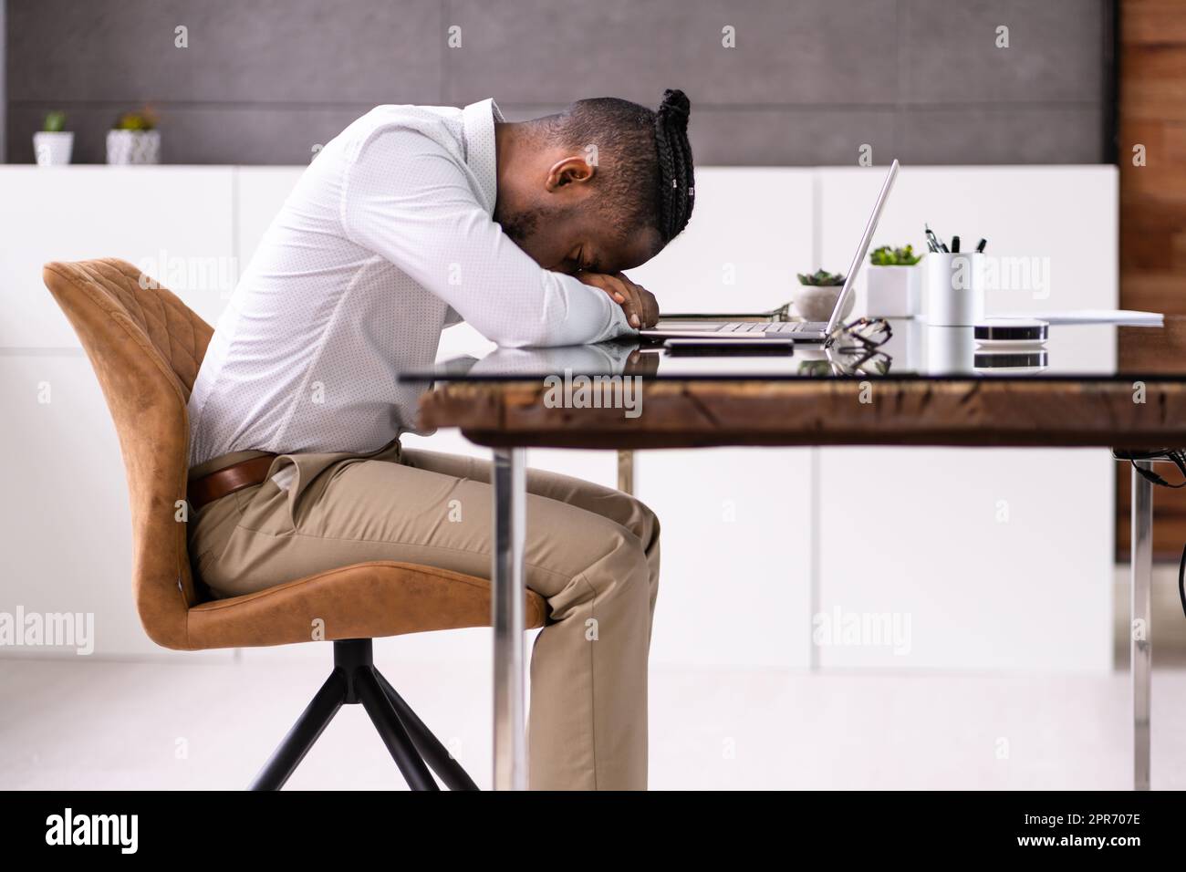 Banner Of Tired African Businessman Sleeping Stock Photo