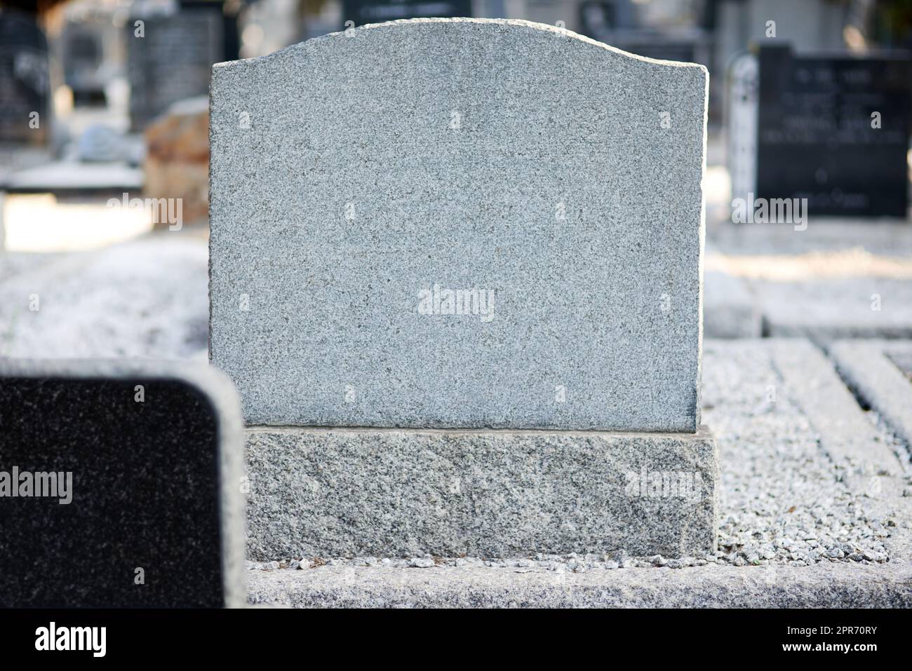 Rest in peace. Shot of a gravestone in a cemetery. Stock Photo