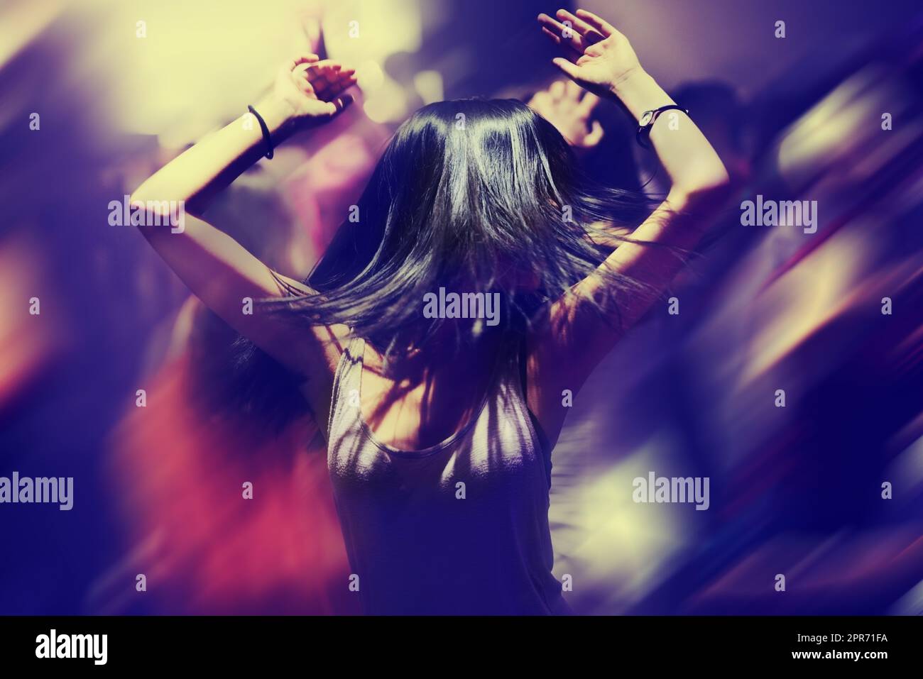 Dancing the night away. A young woman dancing. Stock Photo