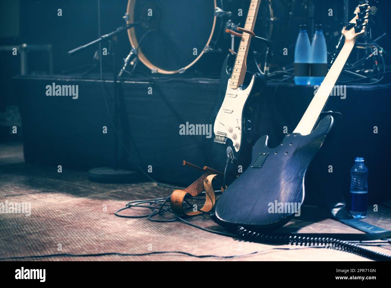 Waiting to be played. Musical instruments on an empty stage before a show. Stock Photo