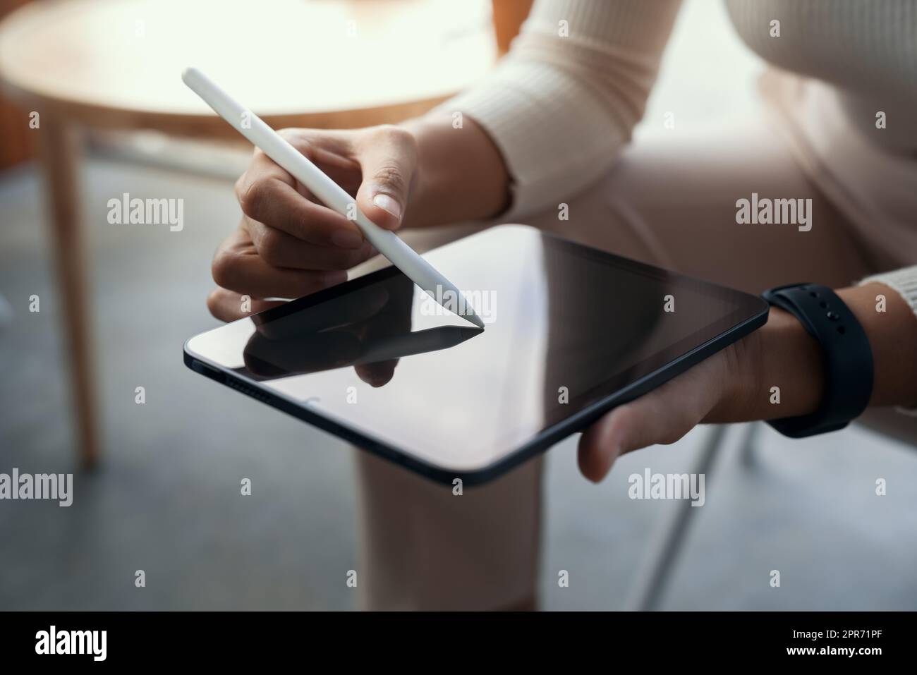 close-up hand using stylus pen on digital tablet Stock Photo