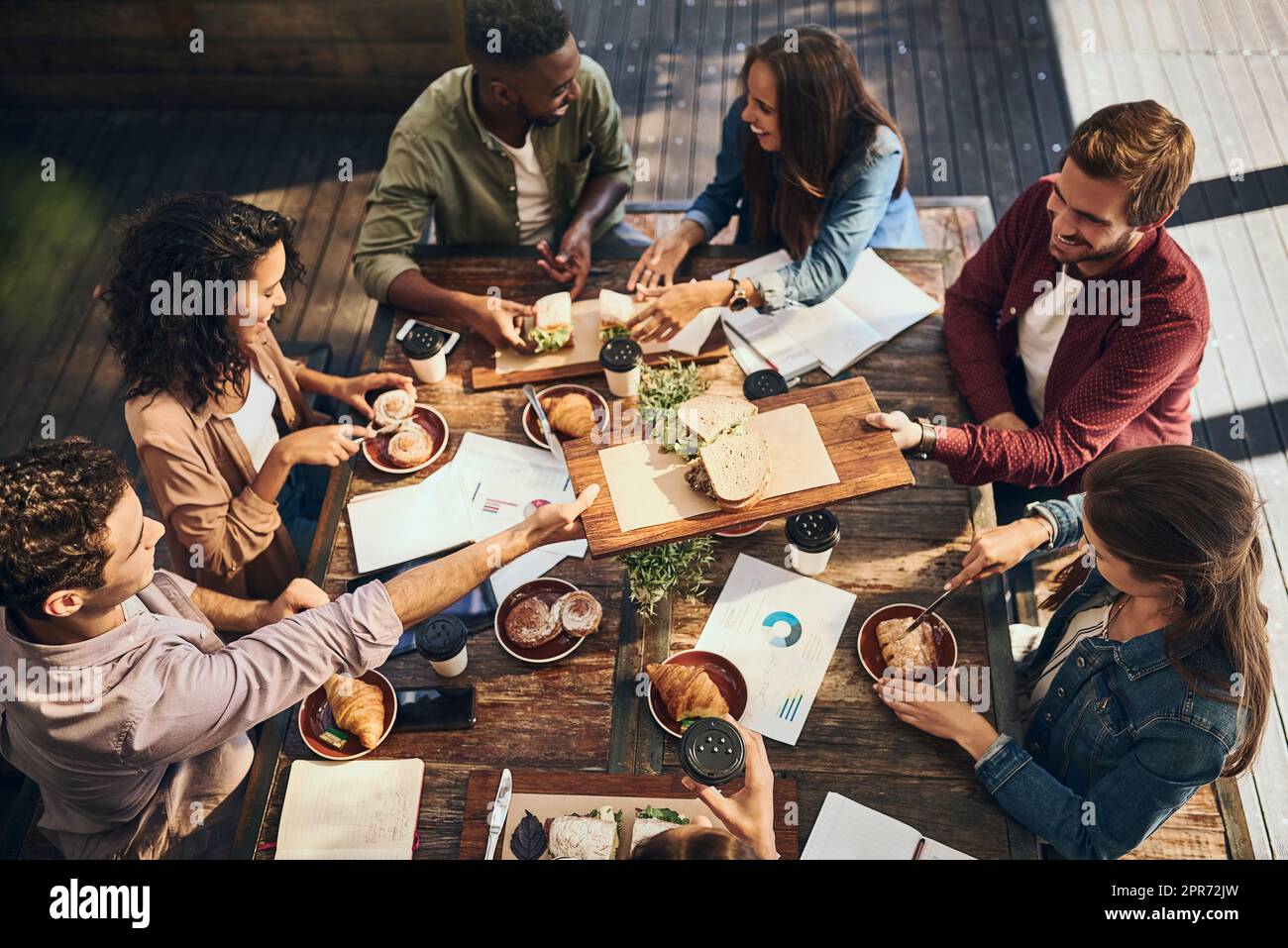 This lunch is bringing out the best in this meeting. Shot of a group of