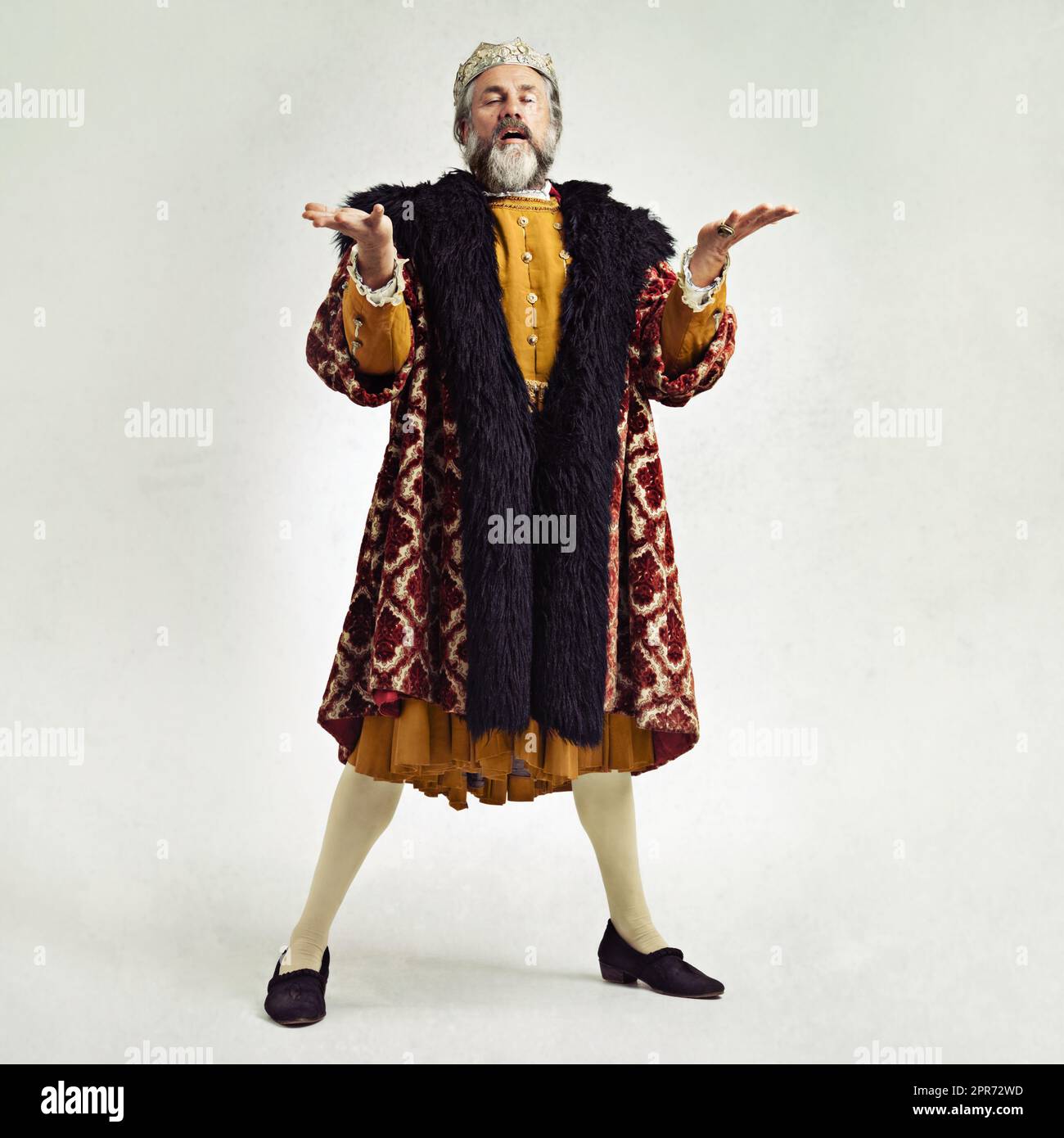 Im a slightly mad king you know.... Studio shot of a richly garbed king. Stock Photo