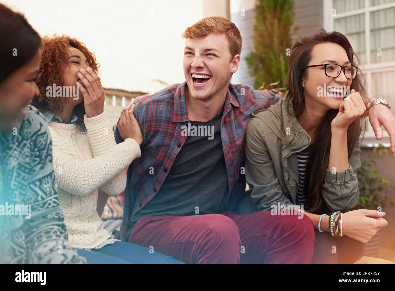 Never stop the good times. Cropped shot of a group of friends laughing and having a good time. Stock Photo