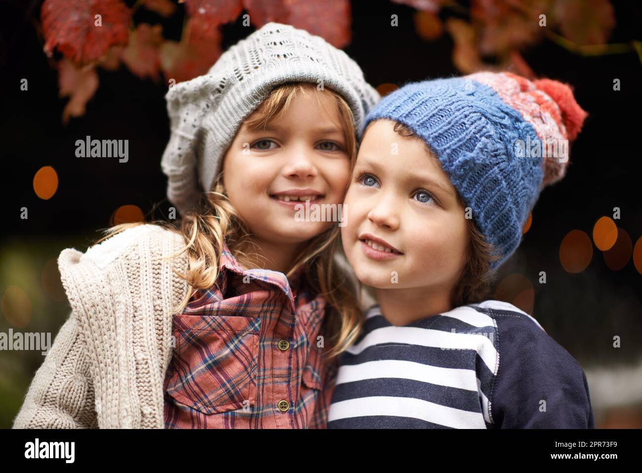 Hes not just my brother - hes my best friend. Portrait of a cute brother and sister standing outdoors on an autumn day. Stock Photo