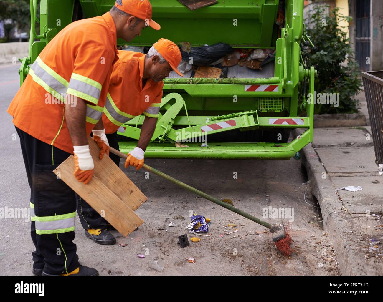 Keeping the city clean. Cropped shot of a team of garbage collectors. Stock Photo