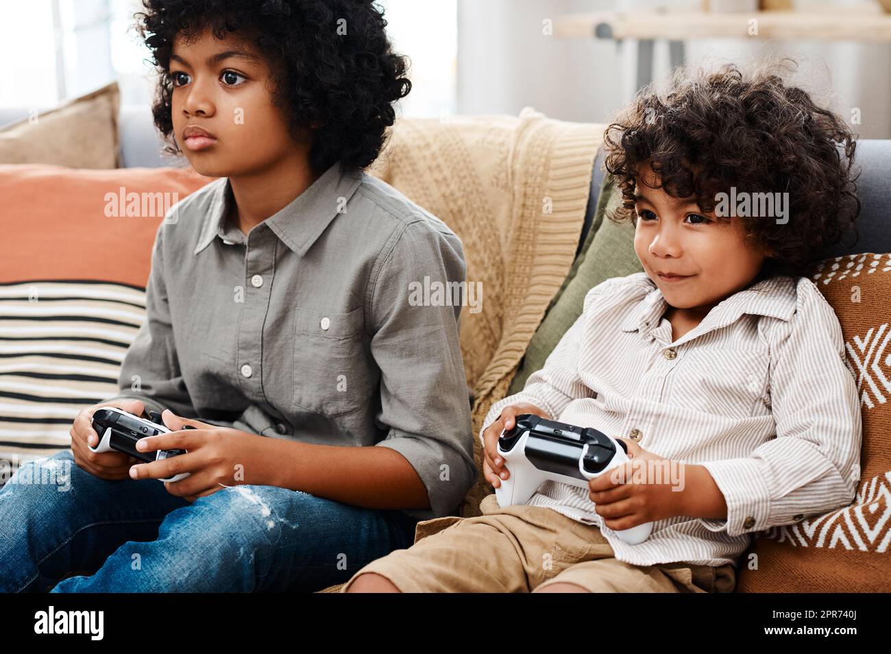 Happy Little Cute Kid Playing Video Game. the Boy Has Addiction To