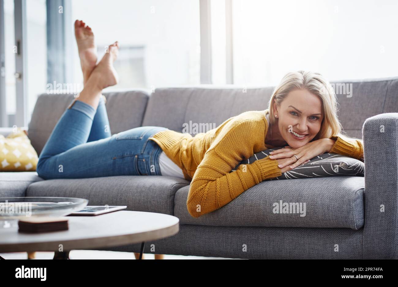 Portrait smiling mature woman lying couch home hi-res stock photography and  images - Alamy