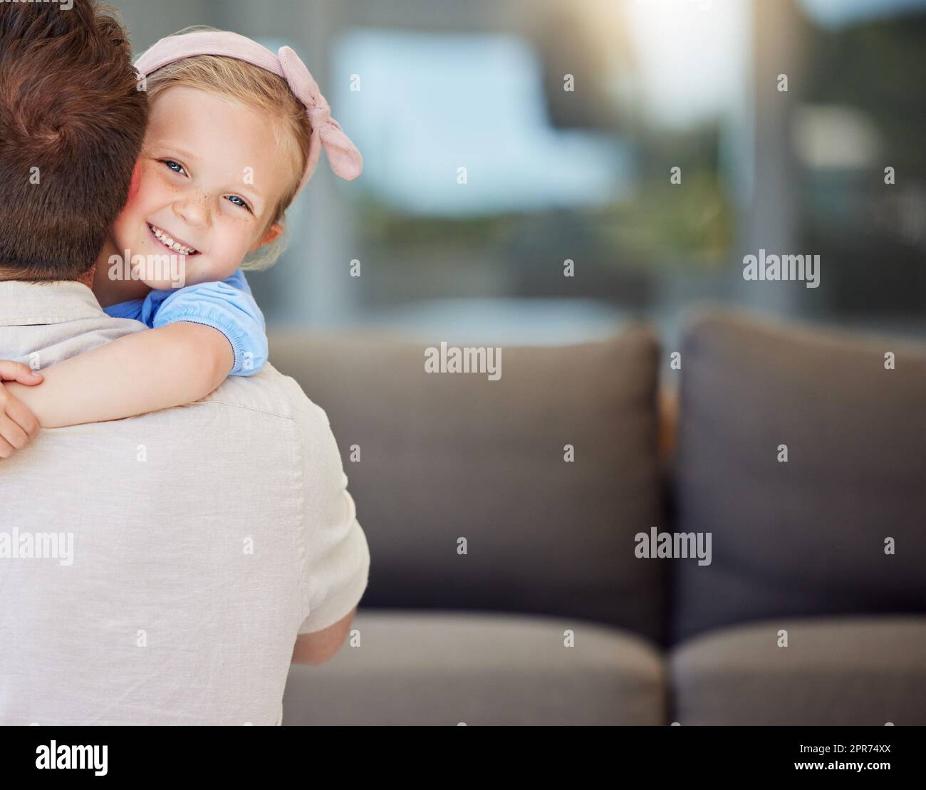 Little preschooler girl hugging father. Sweet daughter embracing loving