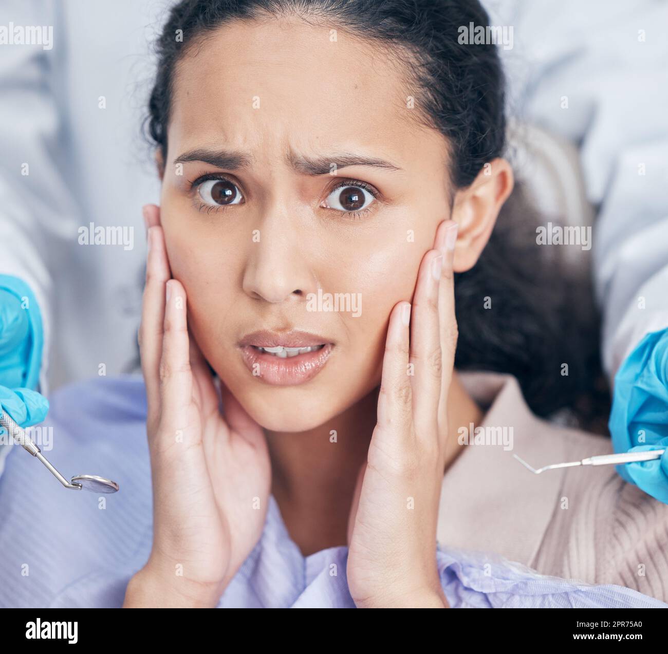 Trips to the dentists can be a nightmare. Shot of a young woman looking