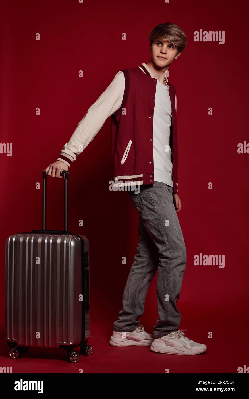 Young excited caucasian man tourist with suitcase Stock Photo