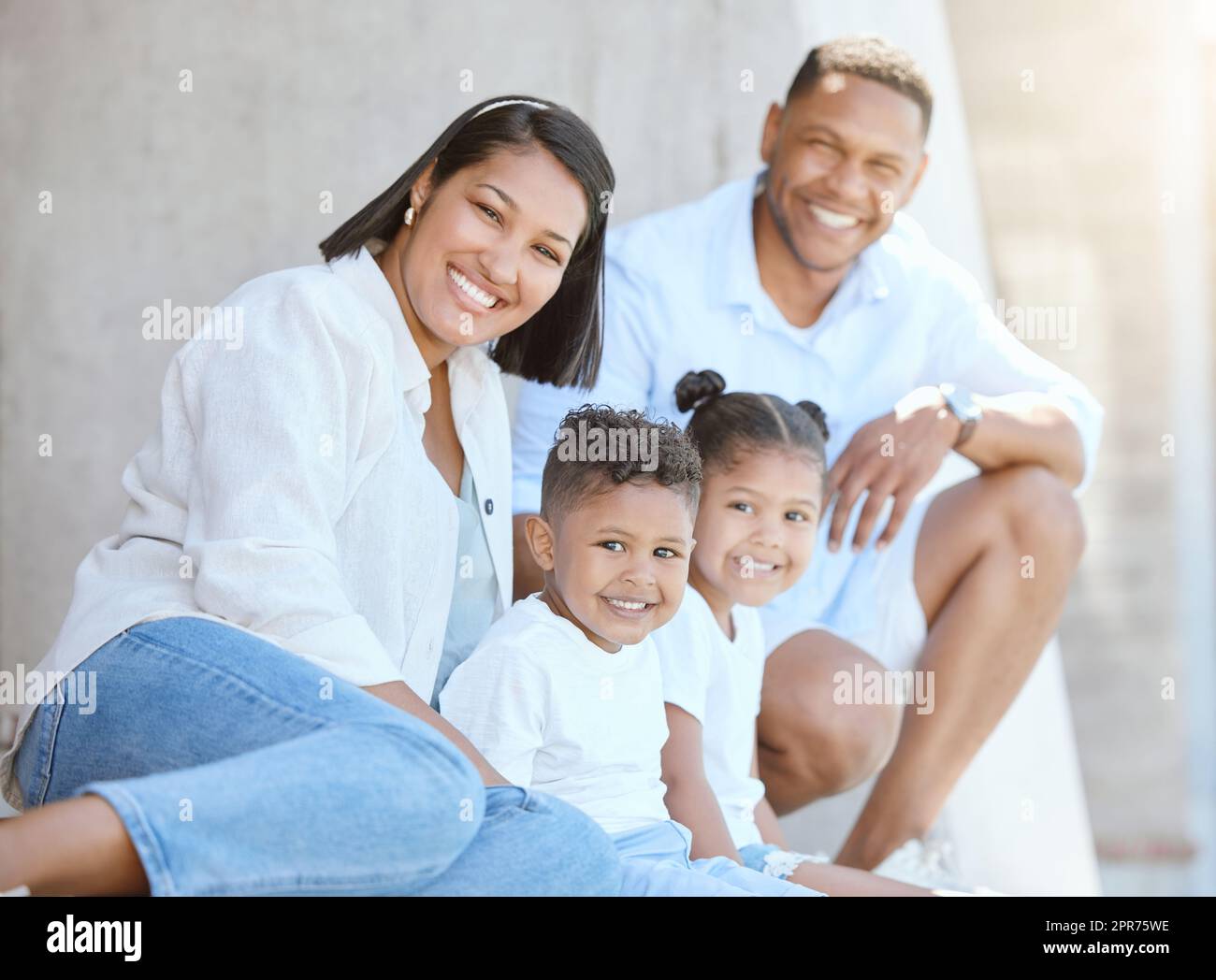 Getting back to basics. Shot of a beautiful young family bonding outside. Stock Photo