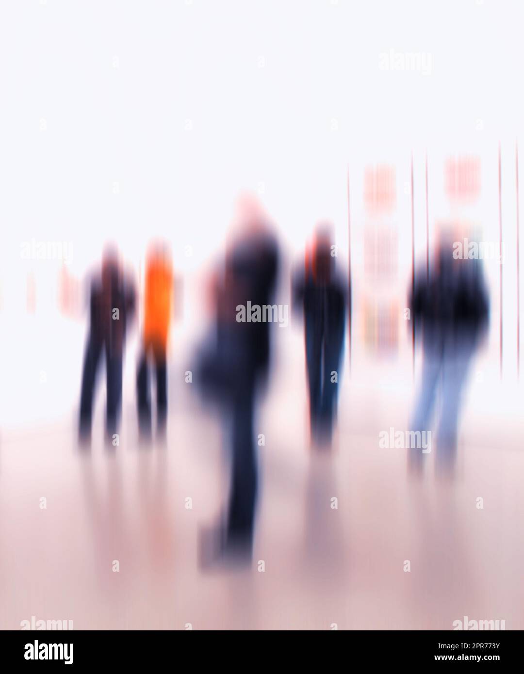 Group of people in the lobby of a modern art center with a blurred background. Crowd of blurred people at exhibition or in a museum. People standing around inside a hall Stock Photo
