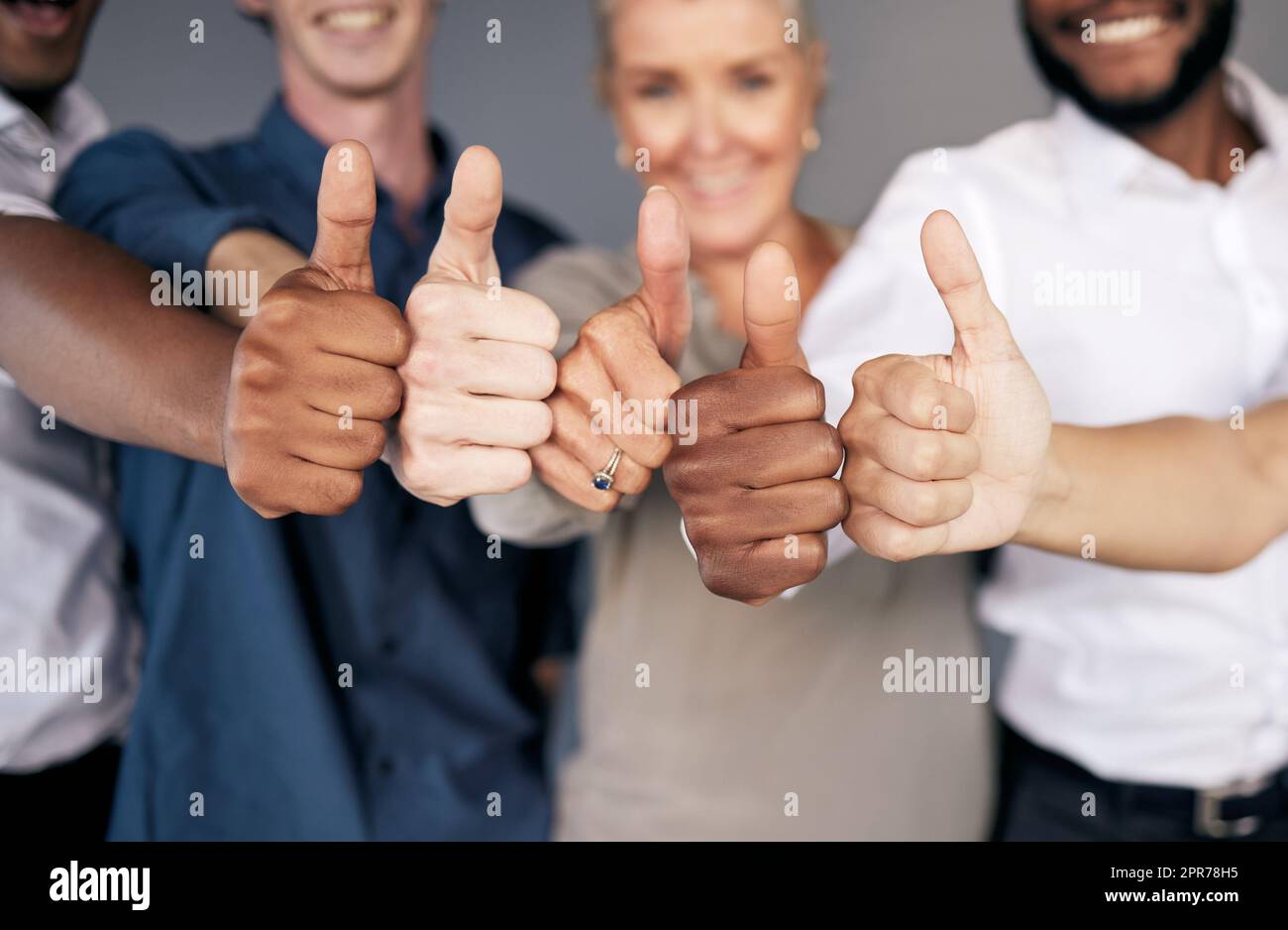 Workers team thumbs up hi-res stock photography and images - Alamy