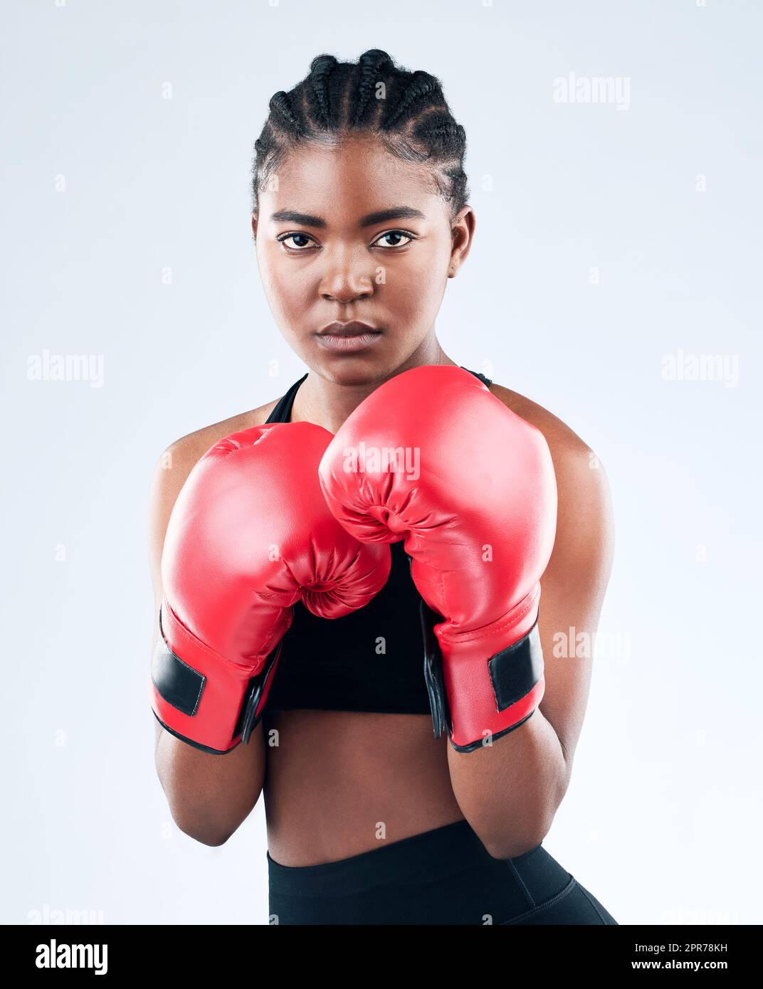 An athletic woman in boxers gloves posing for the camera Stock Photo - Alamy