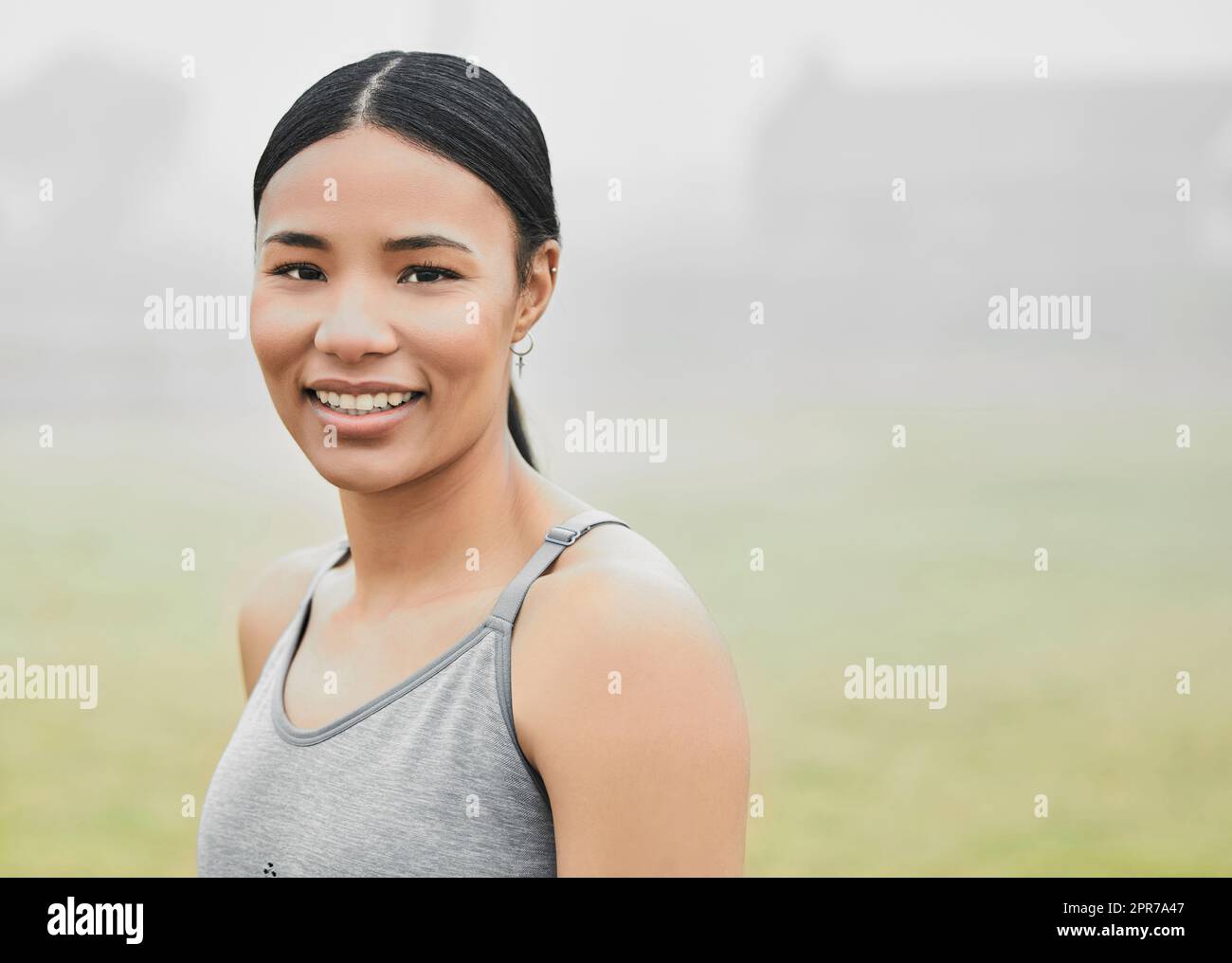 Working out always puts me in a good mood. Cropped portrait of an attractive young female athlete exercising outside. Stock Photo