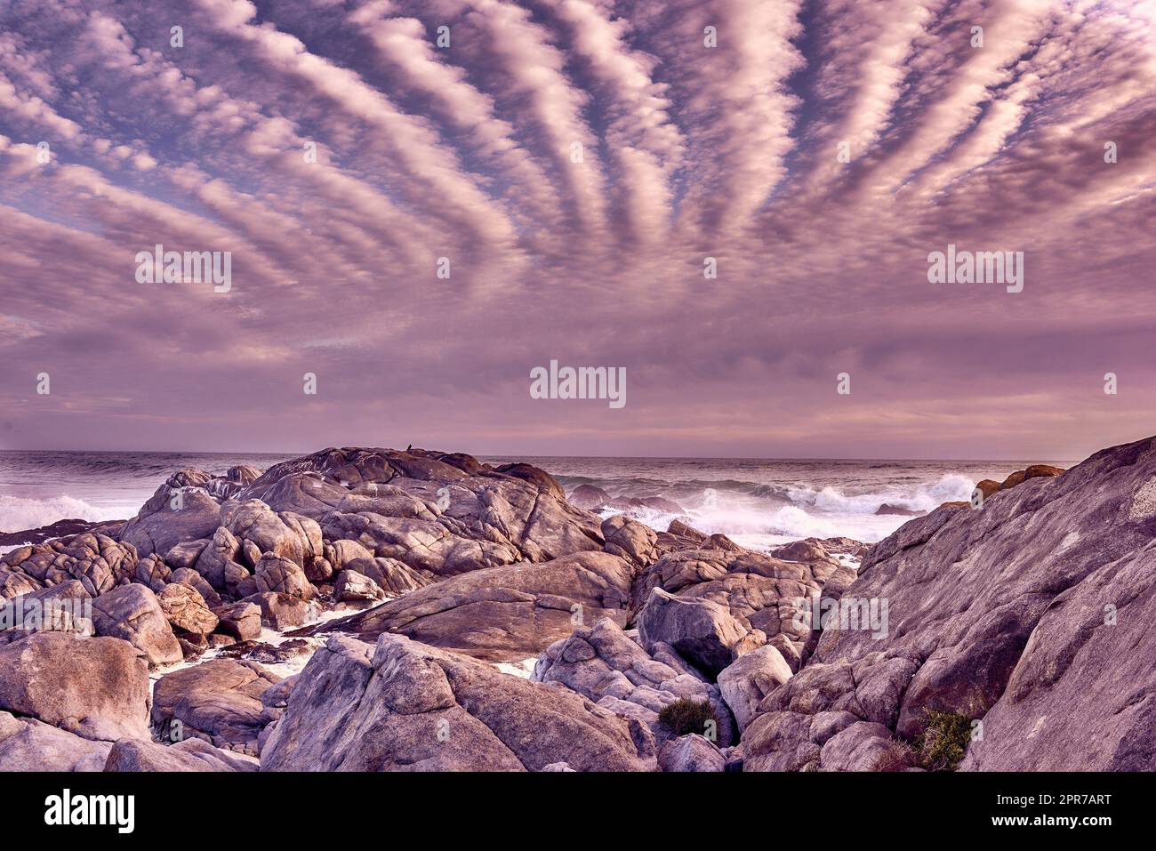 Dreamy beach. Ocean view - Camps Bay, Table Mountain National Park, Cape Town, South AfricaBeach, sunshine and clouds. Stock Photo